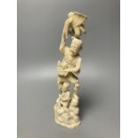 A Japanese walrus ivory okimono of a fisherman and boy, height 30cm