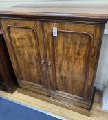 A Victorian mahogany two door cabinet, width 104cm, depth 42cm, height 110cm