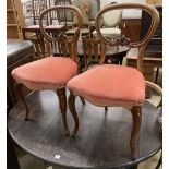 A set of four Victorian mahogany balloon back dining chairs