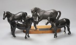 A Beswick Black Beauty and Foal, and three other Beswick black horses