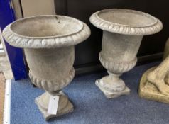 A pair of lead campana garden urns, 28cm diameter, height 36cm