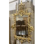 A George III style decorative carved giltwood wall mirror, width 63cm, height 106cm