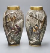 A pair of late 19th century French St Denis painted vases, decorated with birds in a landscape,