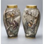 A pair of late 19th century French St Denis painted vases, decorated with birds in a landscape,
