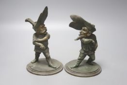 A pair of novelty duelling spelter figural candlesticks, height 20cm