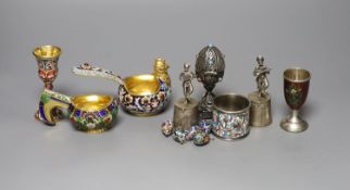 A group of Russian style white metal and enamel items including kovshs, egg pendants and small
