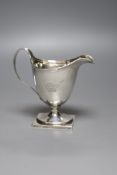 A George III silver helmet shaped pedestal cream jug, Henry Chawner, London, 1795, 13.4cm, 5.5oz,(