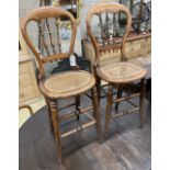 A pair of Victorian spindle back cane seat correction chairs