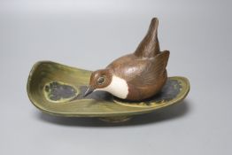 A Norman Makinson Studio pottery 'bird on leaf', length 23cm
