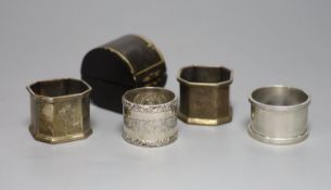 A cased late Victorian silver napkin ring, one other similar pair and a later silver napkin ring,5.