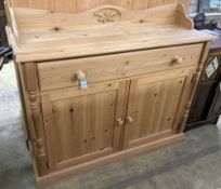 A reproduction pine sideboard, length 122cm, depth 40cm, height 106cm