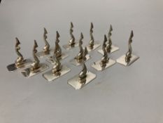 A set of twelve Portugese silver dolphin place/menu holders, height 4cm