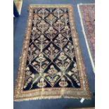 A Caucasian blue ground rug, 230 x 124cm
