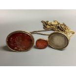 Three assorted 19th century yellow metal overlaid and carnelian set fob seals, two on gilt metal