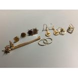 Five pairs of 9ct gold earrings, a 9ct gold tiepin and one other item, gross 9.5 grams.