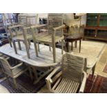 A weathered teak extending garden table, length 240cm extended, depth 100cm, height 77cm together