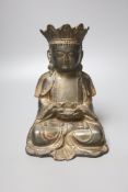 A Chinese gilt lacquered bronze figure of a seated and crowned Buddha, Ming dynasty or later, 21cm