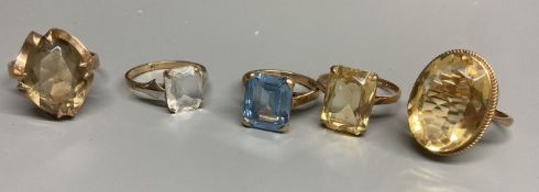Four assorted modern 9ct gold and gem set rings, including citrine and smoky quartz and a similar