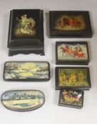 A collection of seven Russian painted lacquer boxes, largest raised on bracket base 15 x 20cm 9.