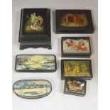 A collection of seven Russian painted lacquer boxes, largest raised on bracket base 15 x 20cm 9.