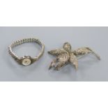 A 1960's silver and marcasite floral spray brooch and a lady's silver and marcasite wrist watch.