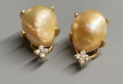 A modern pair of 18k yellow metal, baroque pearl and four stone diamond chip set ear clips, 21mm,