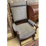 An early 20th century American mahogany rocking chair, width 60cm, depth 52cm, height 108cm