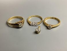 Three assorted 18 carat gold and diamond set dress rings, gross 8.3 g and yellow metal and diamond