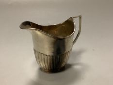 An Edwardian demi fluted silver cream jug, William Hutton & Sons, Sheffield, 1908, 9cm,3.5oz.