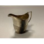 An Edwardian demi fluted silver cream jug, William Hutton & Sons, Sheffield, 1908, 9cm,3.5oz.