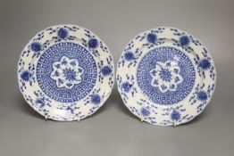 A pair of Chinese blue and white porcelain plates, Kangxi mark and period, with shaped borders and