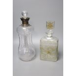 A Victorian wrythen moulded hour glass shaped decanter, with silver collar, 31cm high, togoether