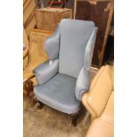 A 1920's Queen Anne style upholstered wing armchair, width 80cm, depth 70cm, height 121cm