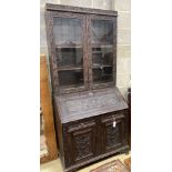 A Victorian carved oak bureau bookcase, width 94cm, depth 54cm, height 203cm