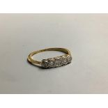 An 18ct and graduated five stone diamond ring, size M, gross 1.5 grams,