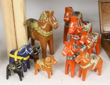 Ten Swedish painted wood Folk Art horses, some by Akta