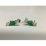 A modern pair of white metal, emerald and diamond set ear studs, 13mm, gross weight 2.6 grams.