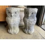 A pair of reconstituted stone owl garden planters, height 50cm