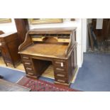 An Edwardian mahogany roll top desk with 'S' shape tambour, length 122cm, width 82cm, height 114cm