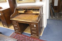 An Edwardian mahogany roll top desk with 'S' shape tambour, length 122cm, width 82cm, height 114cm