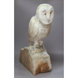 A carved wood owl, 63cm high