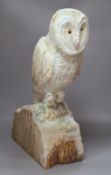 A carved wood owl, 63cm high