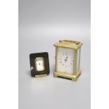A brass carriage timepiece and a Matthew Norman timepiece