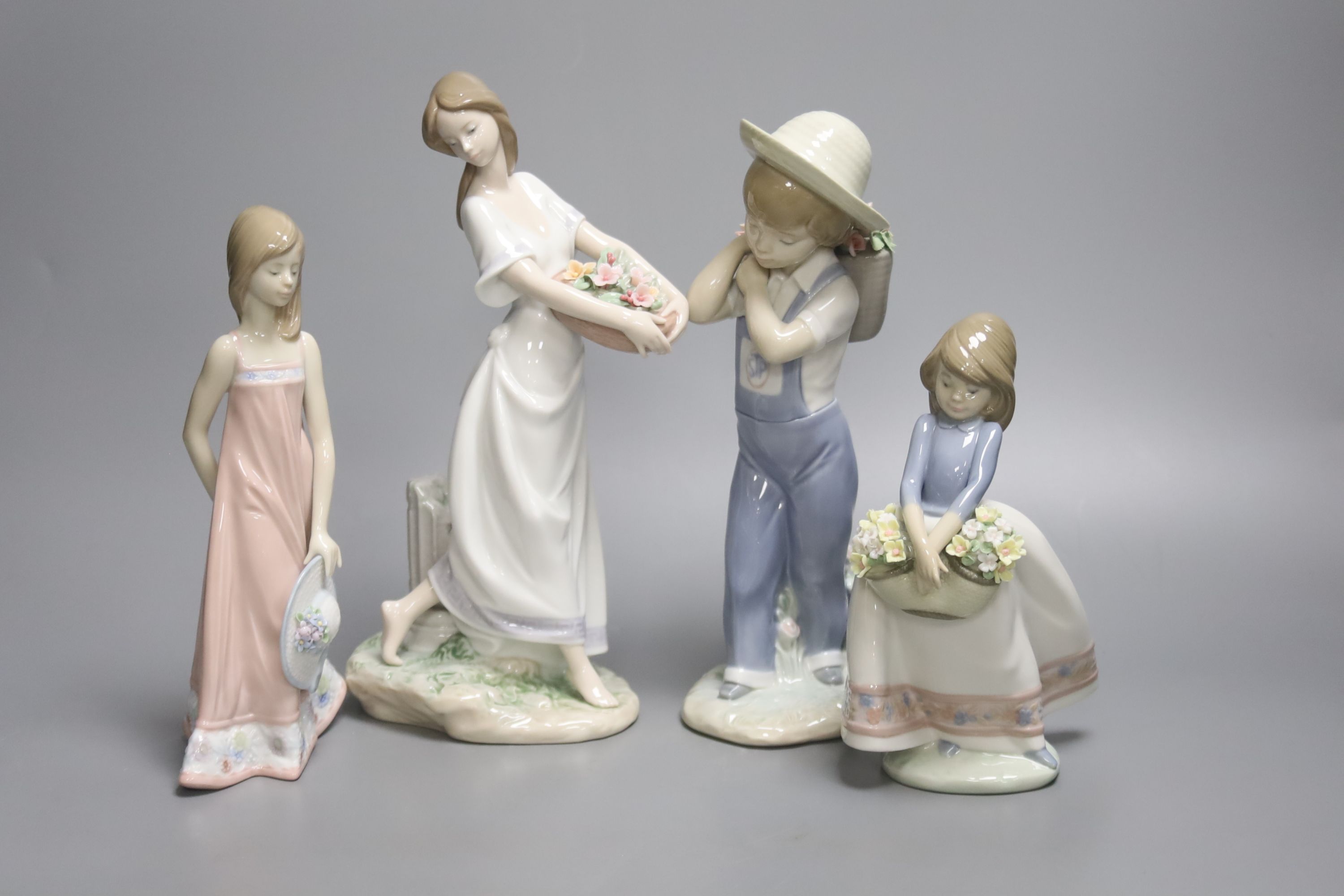 A Lladro figure of a boy "Flower Harvest" No. 1286, "May Flowers", Girl with Straw Hat, and '