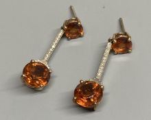 A pair of Art Deco style yellow and white metal, citrine and diamond chip set drop earrings, (no