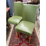 A set of eight contemporary oak and green leather dining chairs
