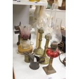 A pair of candle storm lamps, two oil lamps, a paint stripper, a jeweller's blow lamp and oil can,