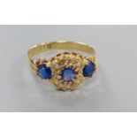 A George V 18ct gold, sapphire and diamond chip cluster dress ring, size R/S, gross 2.7 grams.