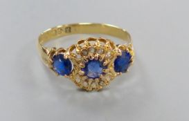 A George V 18ct gold, sapphire and diamond chip cluster dress ring, size R/S, gross 2.7 grams.