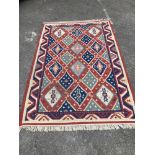 A Kelim flatweave polychrome geometric carpet, 240 x 160cm